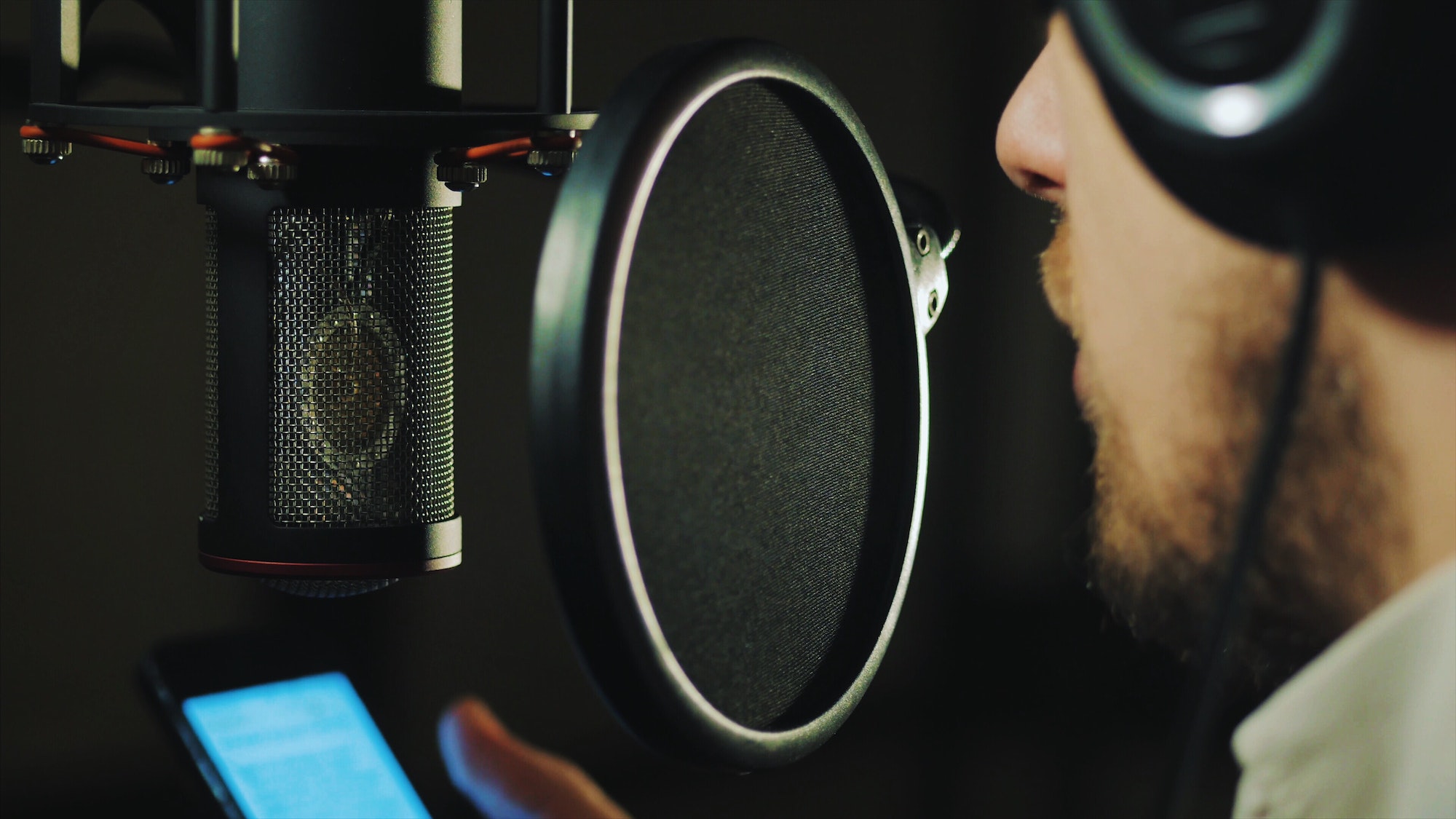 Man reading rap in recording studio